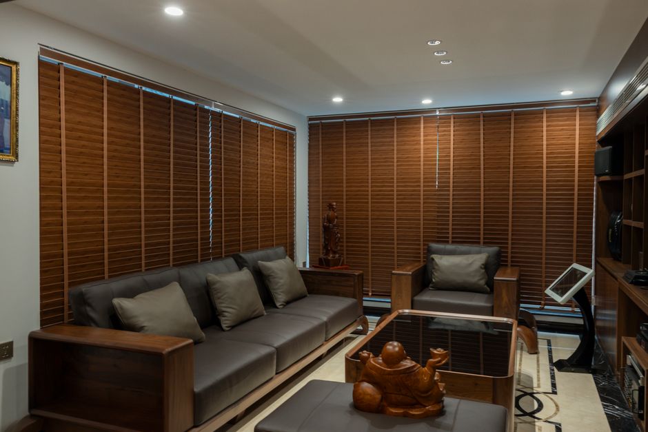 Modern living room with elegant custom window blinds allowing natural light